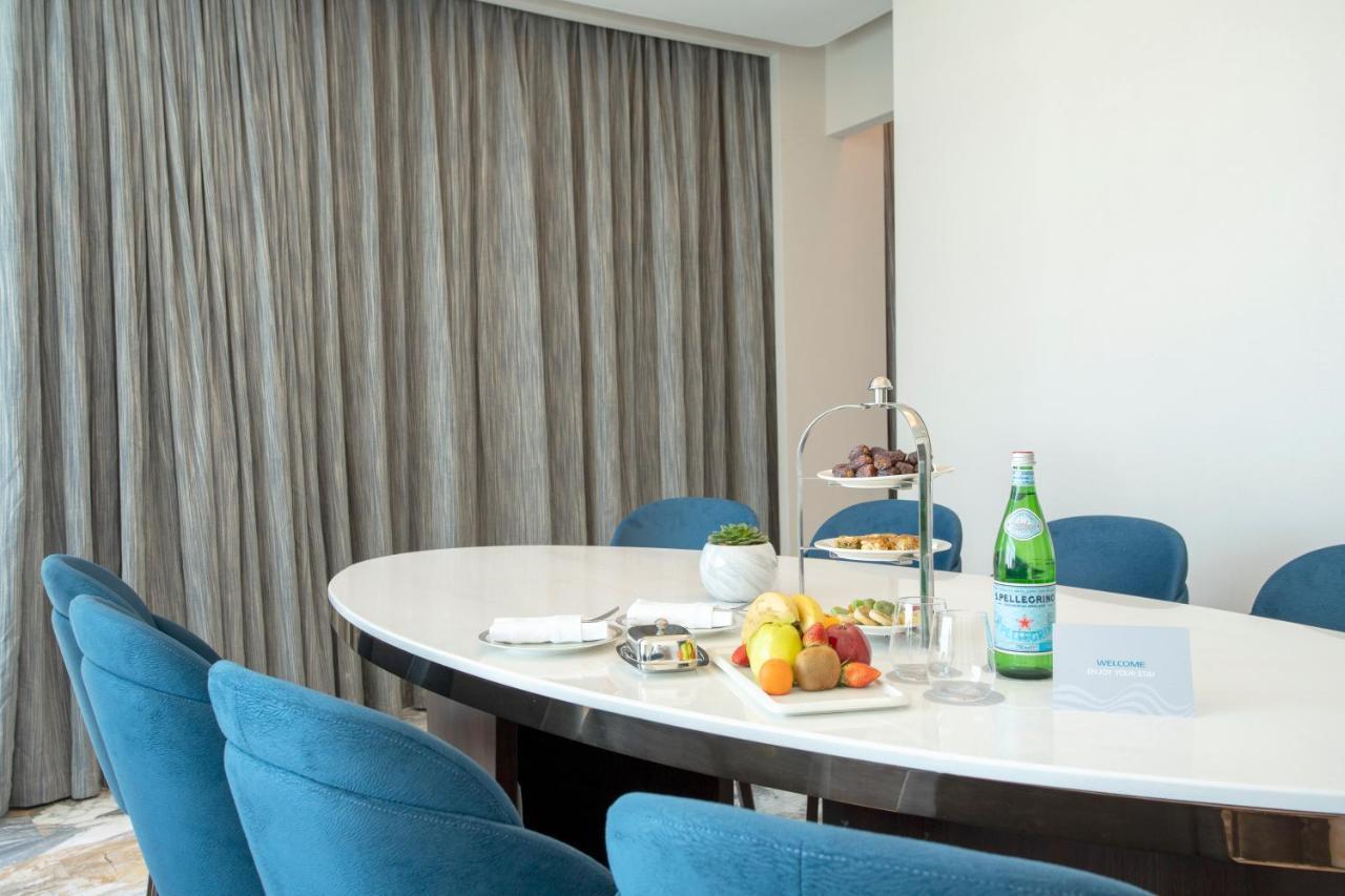 Century Marina Hotel - Lusail Екстер'єр фото A table with a bottle of mineral water
