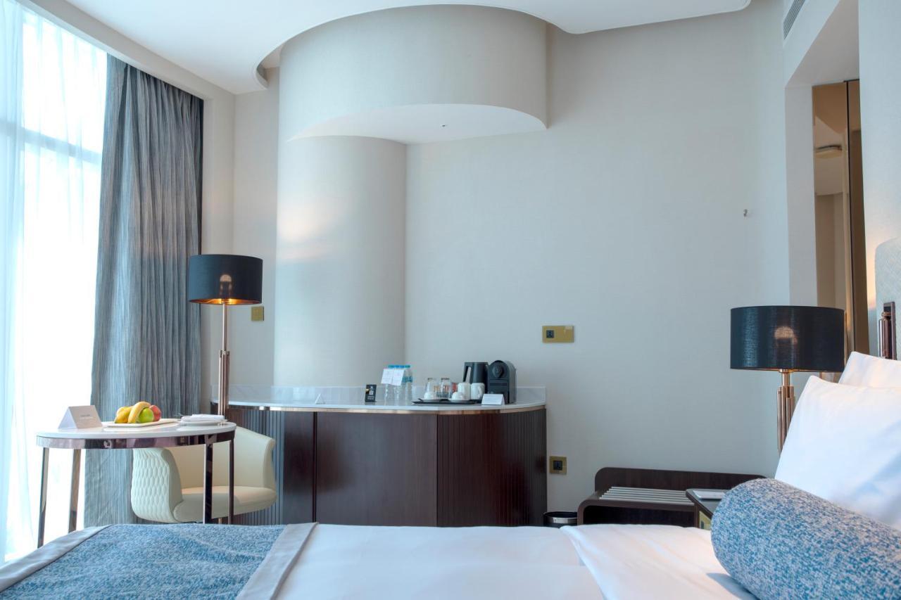 Century Marina Hotel - Lusail Екстер'єр фото A room at the hotel